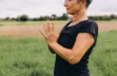 Person meditating outdoors, a mind-body practice that supports joint health