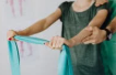 Person stretching their arms to support joint mobility